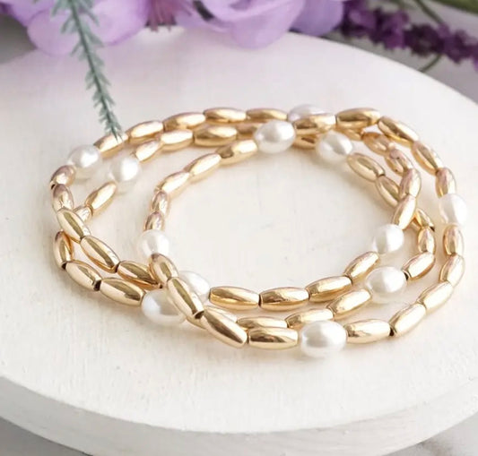 2 set pearl/gold brace.