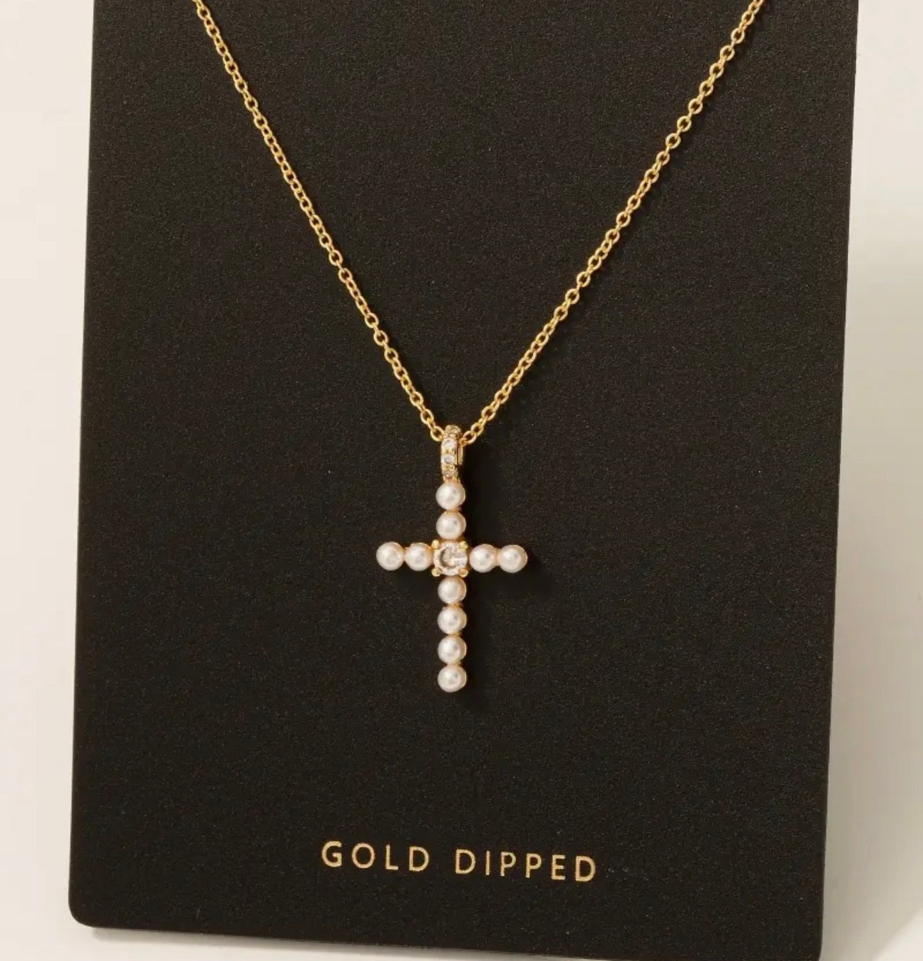 Gold pearl cross neck